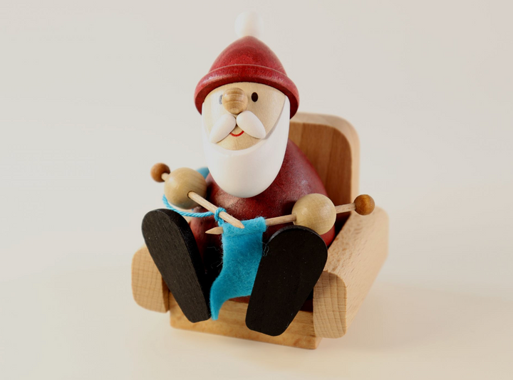 Weihnachtsmann Collectibles - Santa Knitting in Armchair